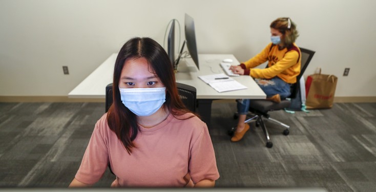 students in masks using the computer labs and social distancing 