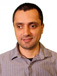 Khaled Musa in front of a white background